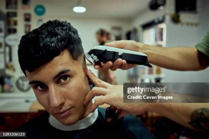 Barbershop customer fighting for life after being blasted from close range with a shotgun while having his hair cut