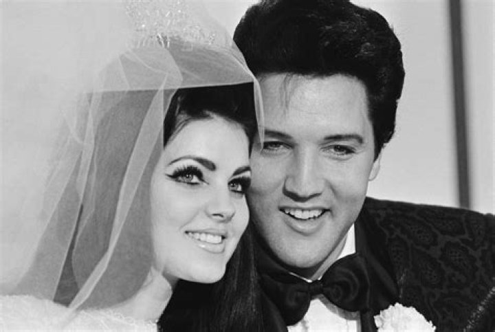 Elvis Presley and his bride Priscilla Ann Beaulieu, pose for photograph following their wedding at the Aladdin Hote-getty