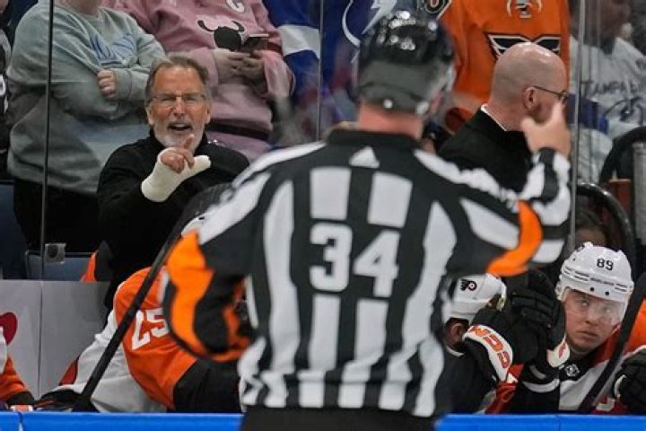 Flyers coach Tortorella suspended 2 games for refusing to leave bench after game misconduct.