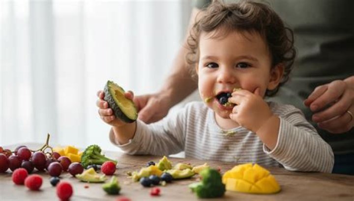 Holding food in his mouth