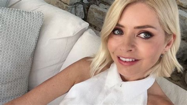 Holly Willoughby sends fans wild with sexy smoky-eyed selfie as she slips into white summer dress