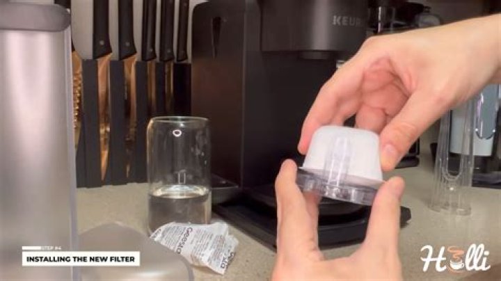 How do you clean a Keurig 2.0 laser lens?