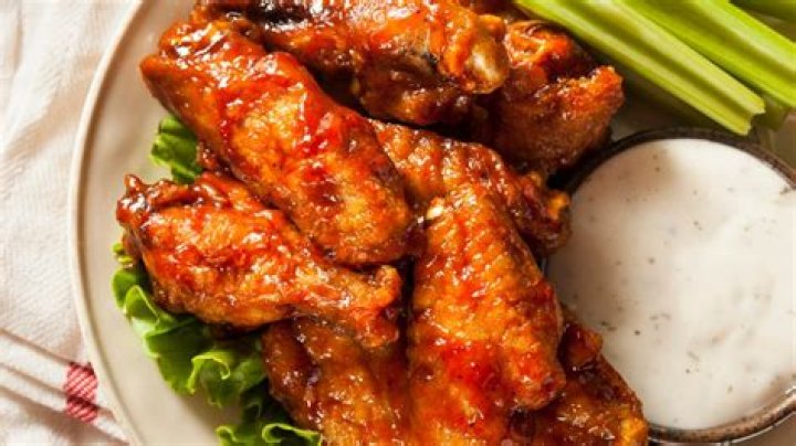 How many chicken wings will Americans eat during the Super Bowl?