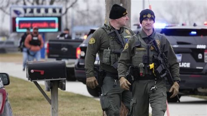 Iowa principal who risked his life to protect students during shooting has died