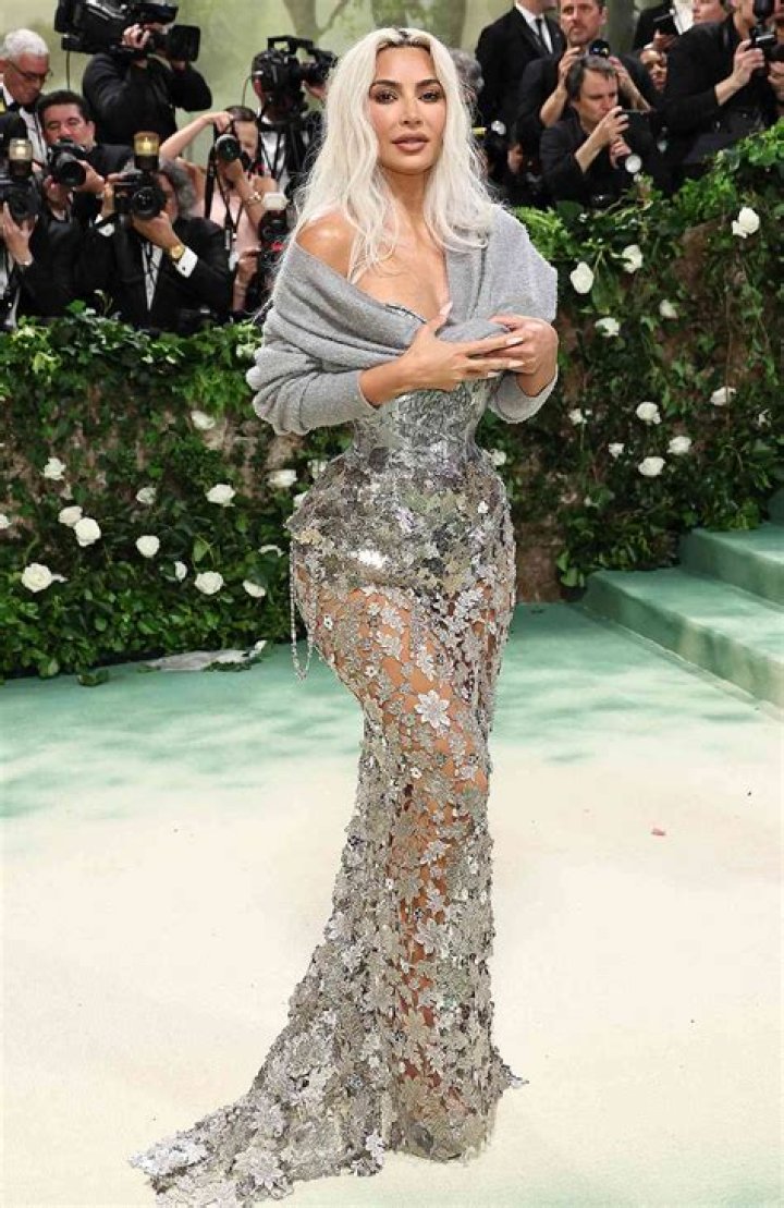 Kim Kardashian looks as hot as a heatwave in shimmery white gown with bandage-like form-fitting silhouette