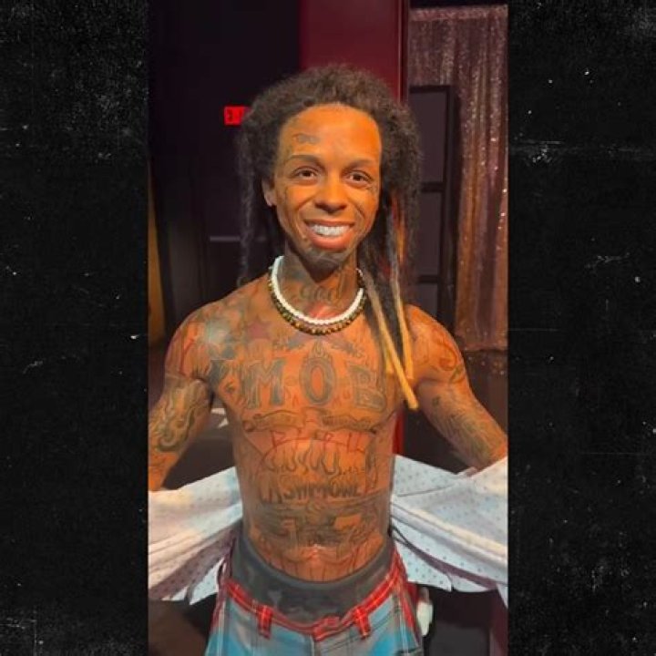 Lil Wayne Gets Two New Face Tats