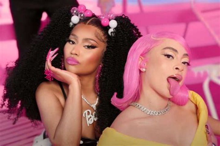Nicki Minaj twerks with puppets while wearing a neon bikini in video for Barbie Dreams