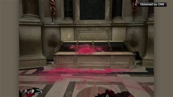 Protesters pour red powder on US Constitution enclosure, prompting evacuation of National Archives