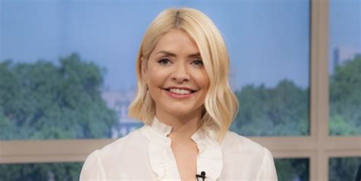 Rylan Clark-Neal can't resist giving Holly Willoughby a flirty comment after she flashes a hint of cleavage on This Morning