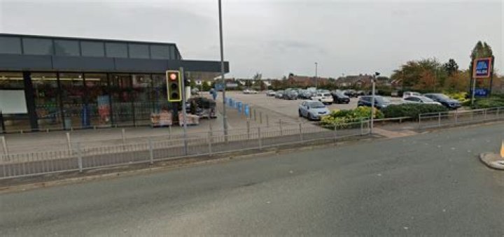 Toddler in nappy found wandering through the streets alone in the rain as worried Aldi shoppers raise the alert
