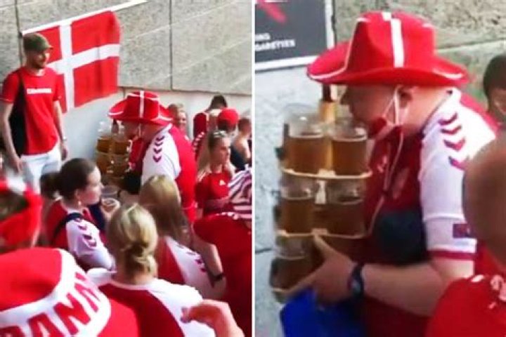 Watch heroic Denmark fan carry at least TWELVE beers and a HOT DOG as fans clap him to seat at Euro 2020