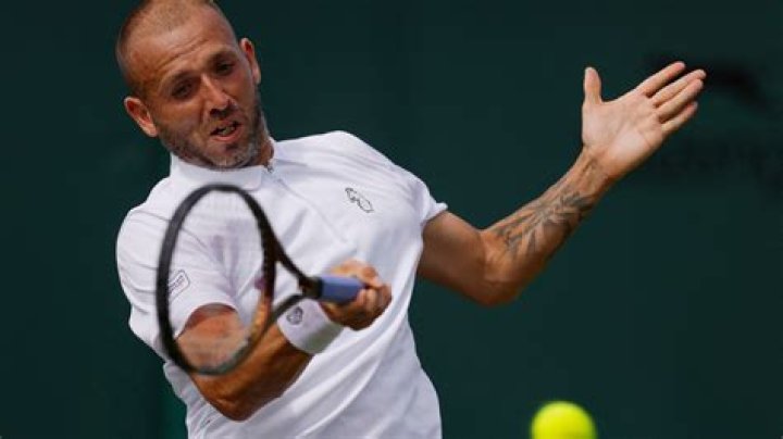 Why is Dan Evans wearing an unbranded T-shirt at the Australian Open?