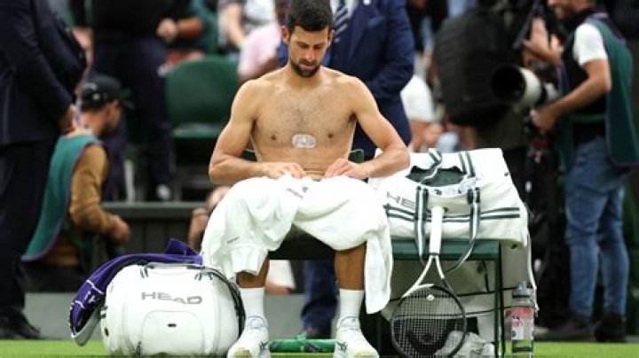 Why is Novak Djokovic wearing a patch on his chest at Wimbledon 2023?