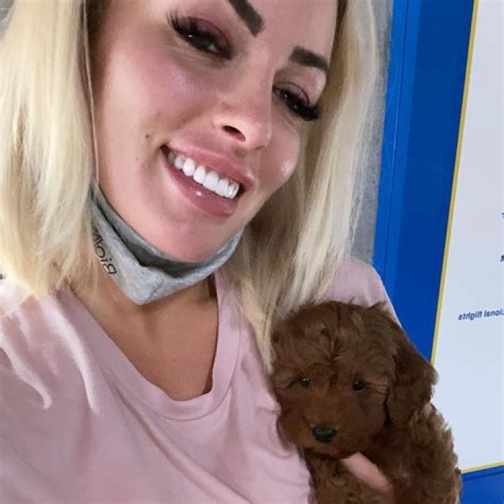 WWE star Mandy Rose poses with adorable puppy Penny while recovering from injury